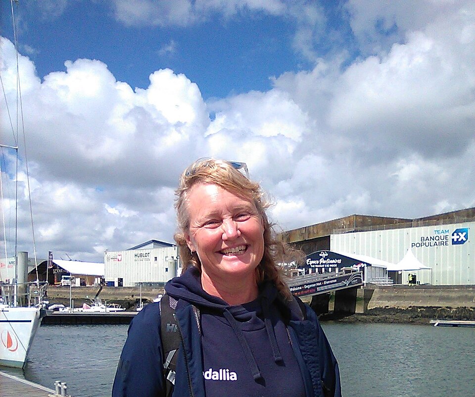 Pip Hare smiling beside the marina at Lorient in April 2024.
